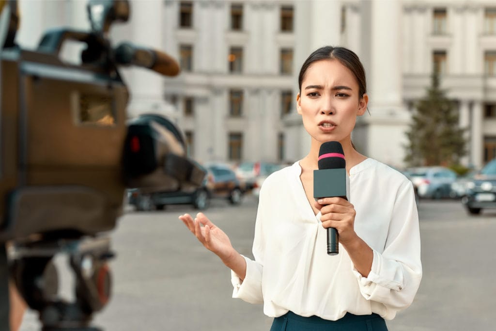 Female reporter on camera