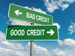 road signs indicating different directions for bad and good credit