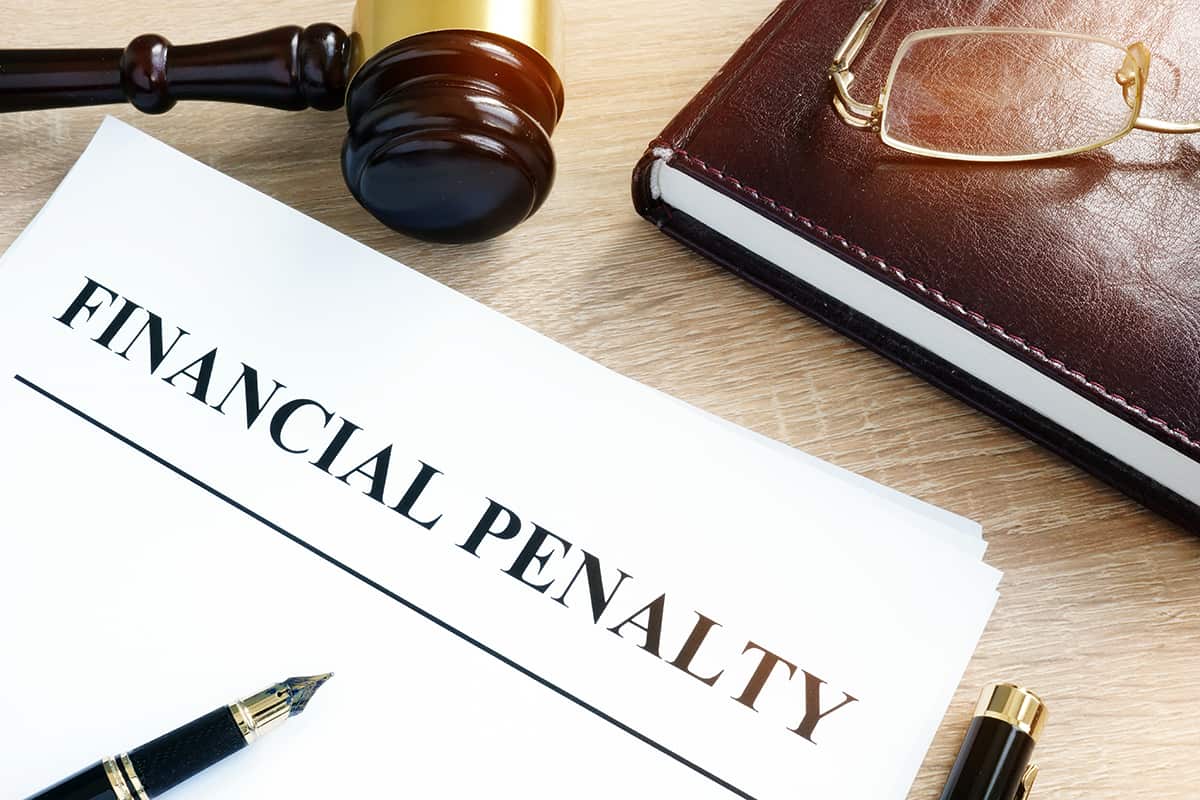 financial penalty paper with pen