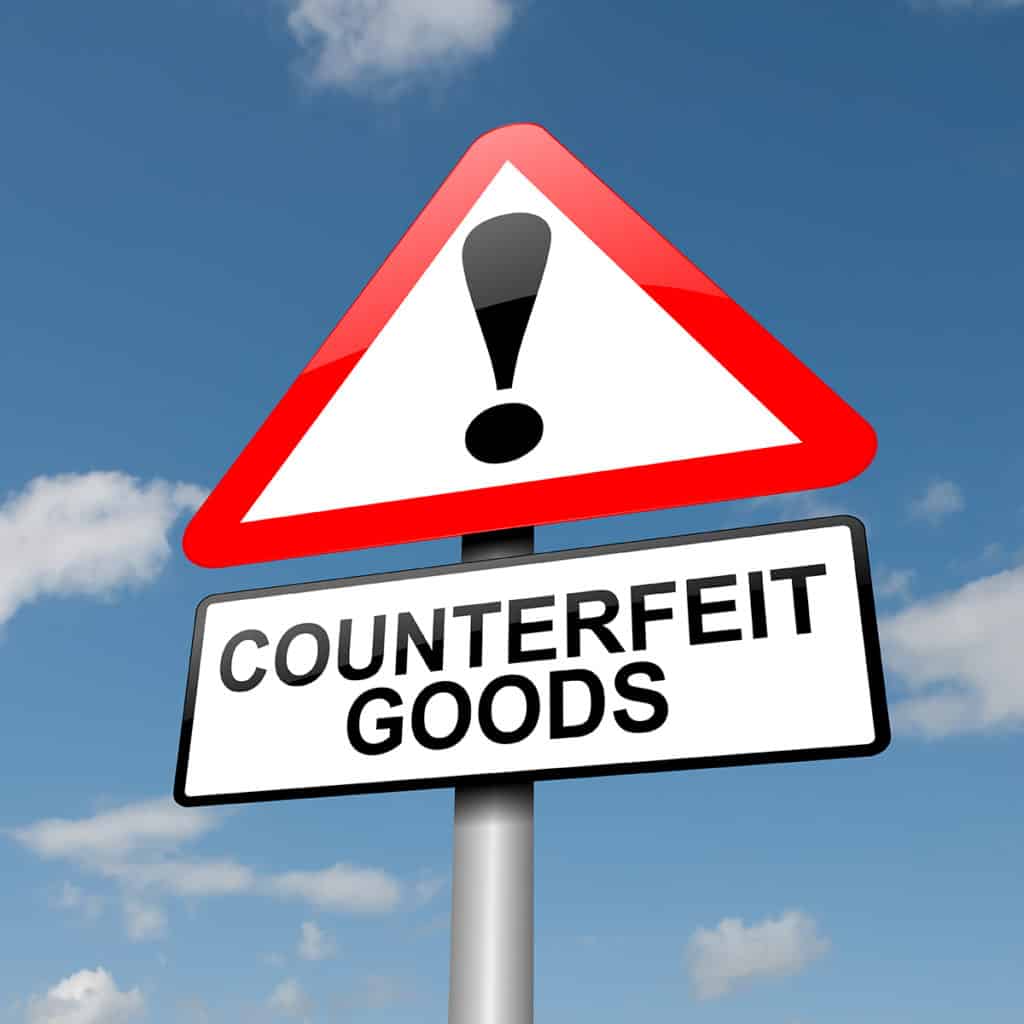 Counterfeit Goods warning sign, human trafficking prosecutors