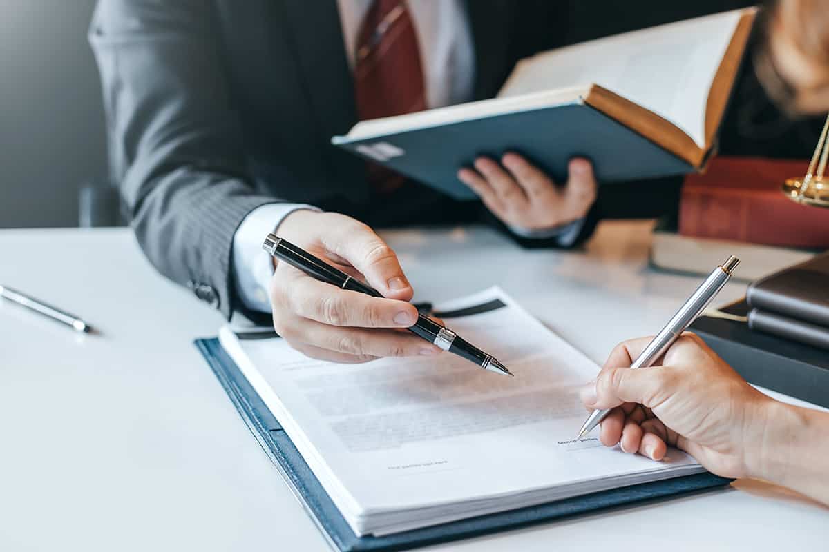 Lawyer and person signing document