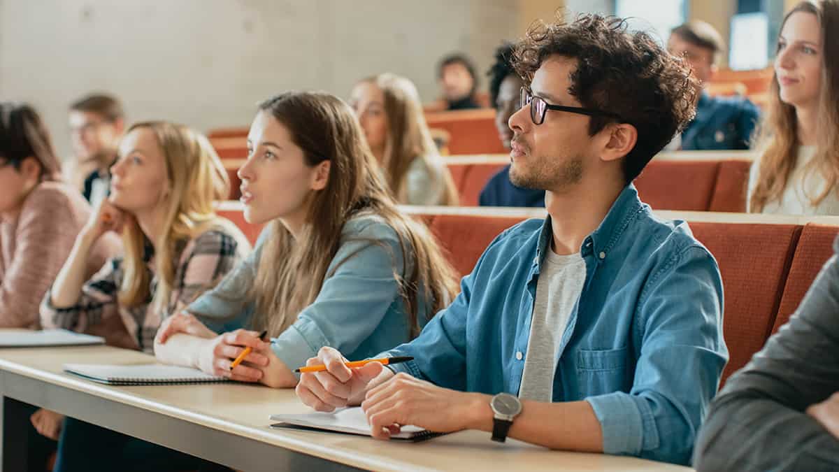 People taking notes in class