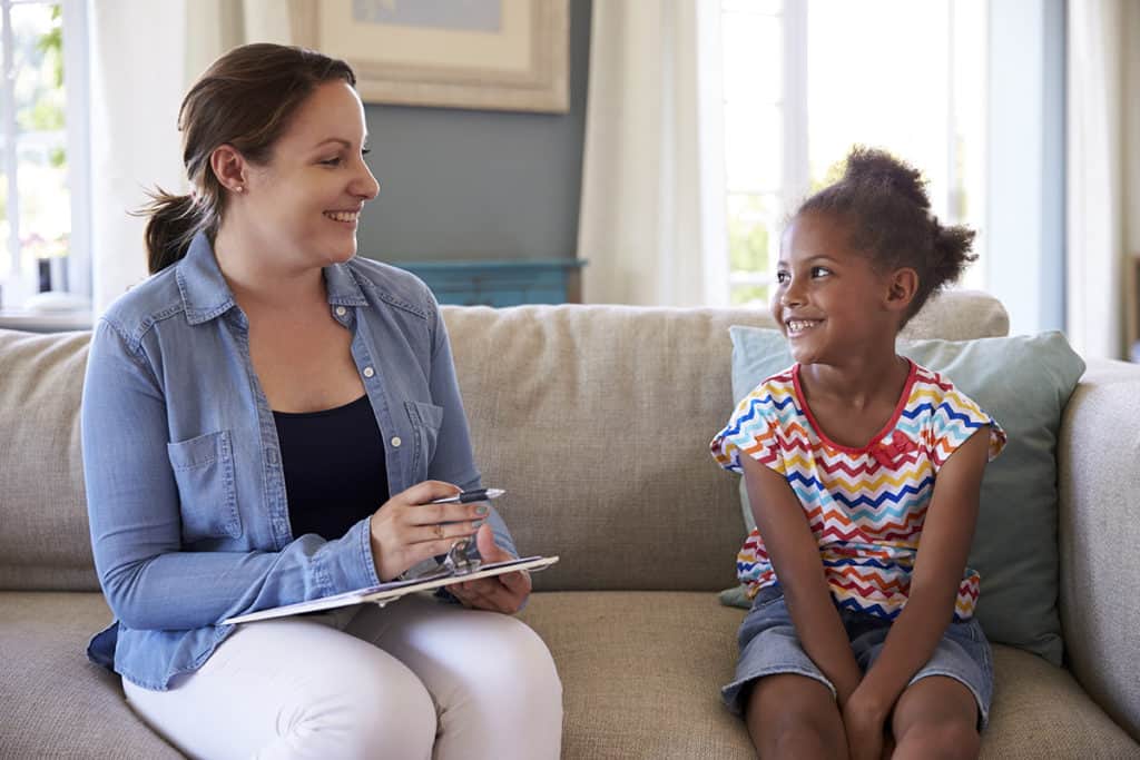 Woman talking to child, human trafficking prosecutors