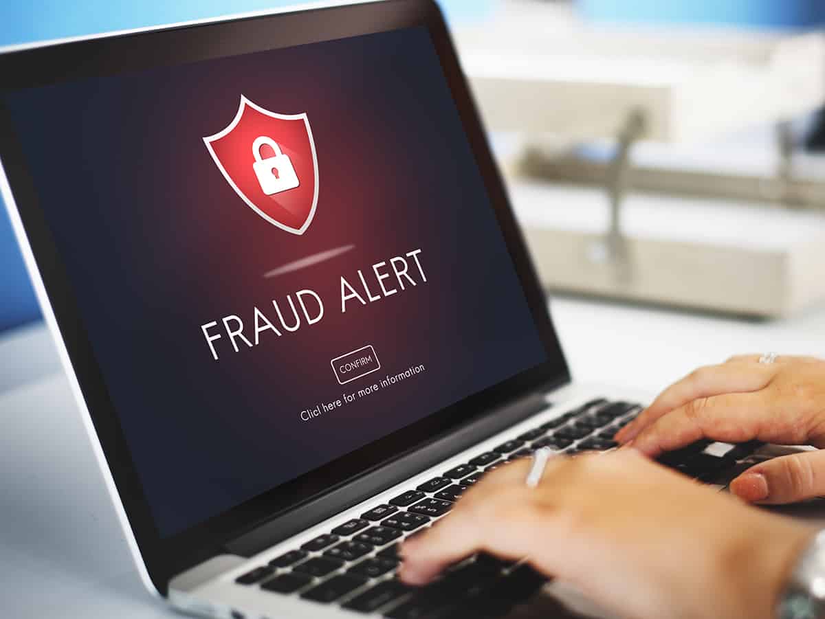 Fraud alert on computer screen