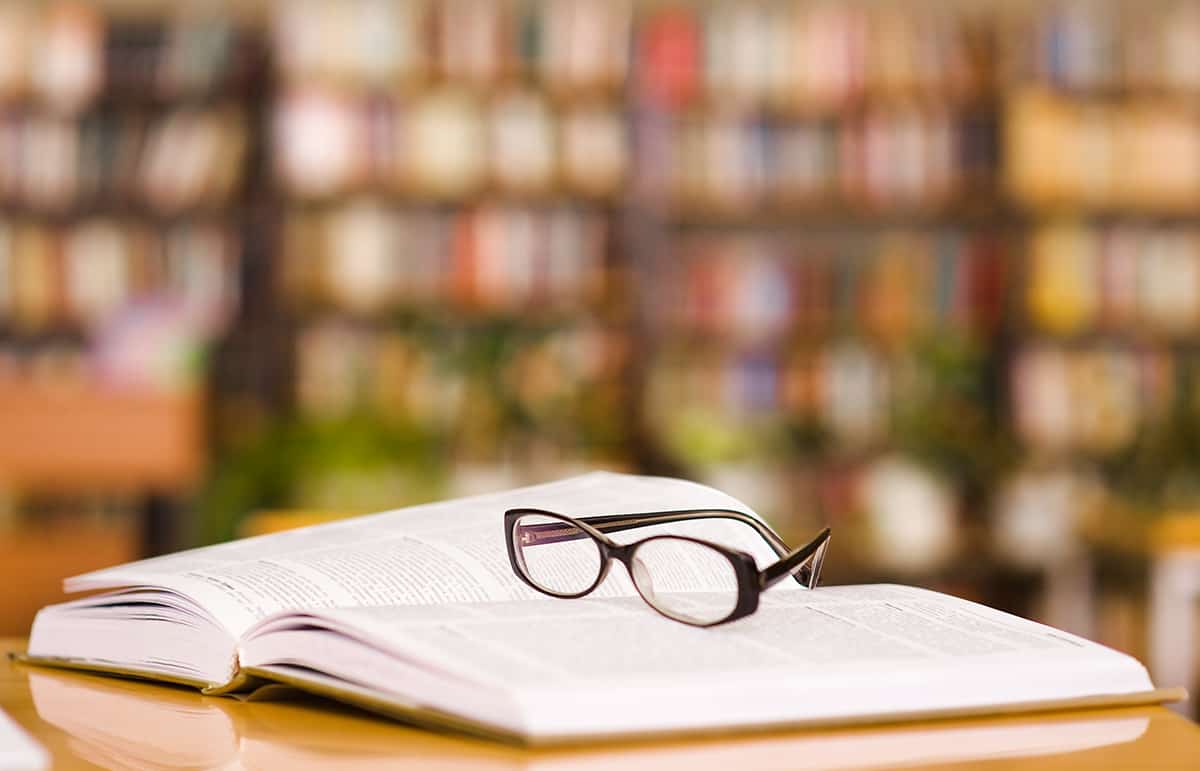 Glasses on top of book