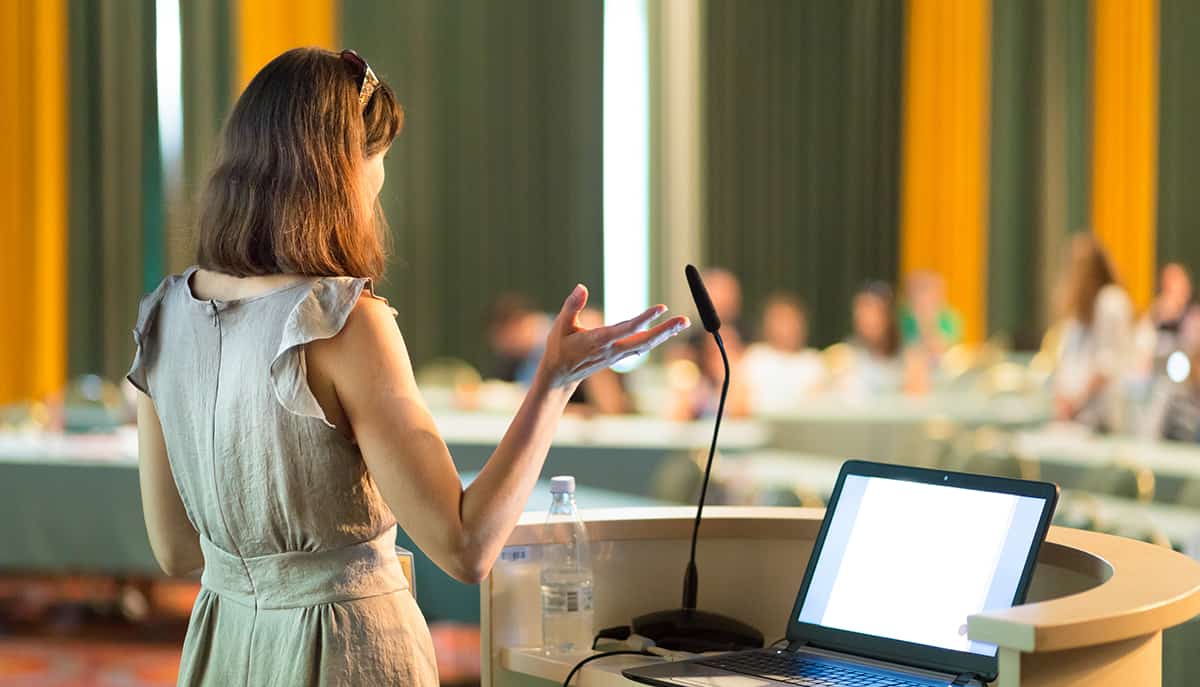 Person giving presentation in lecture hall