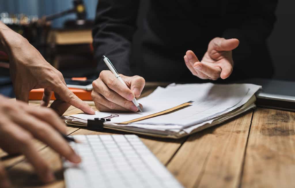 papers and keyboard on desk