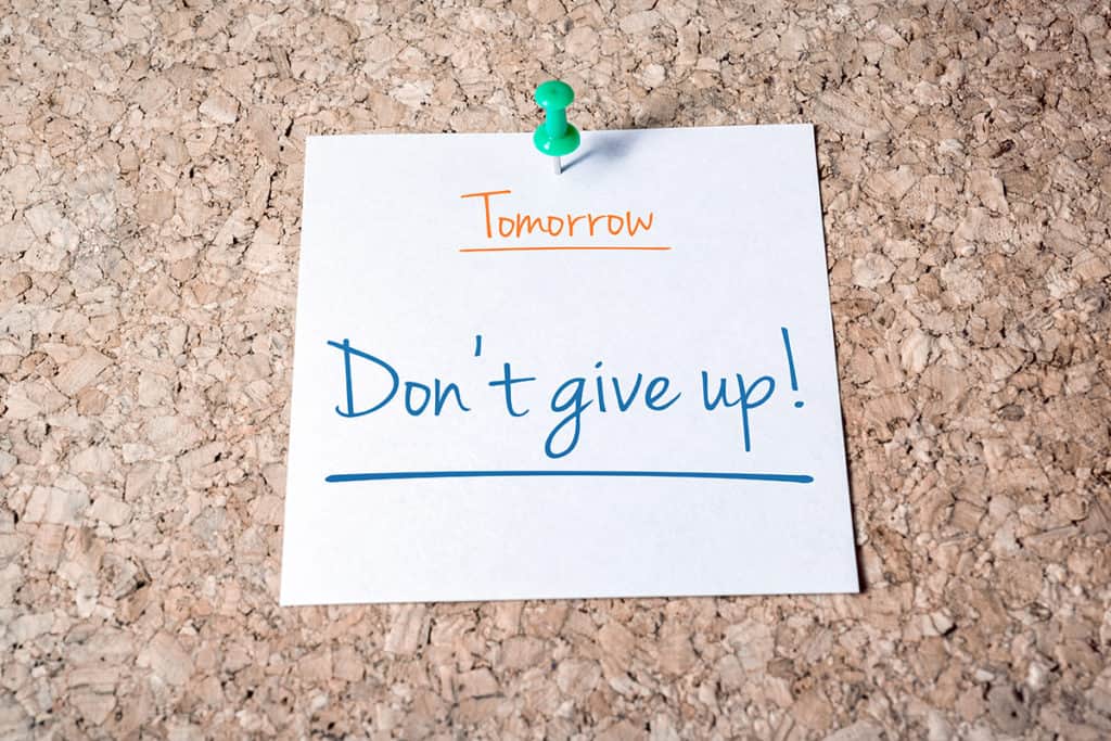 motivation post-it note that says don't give up